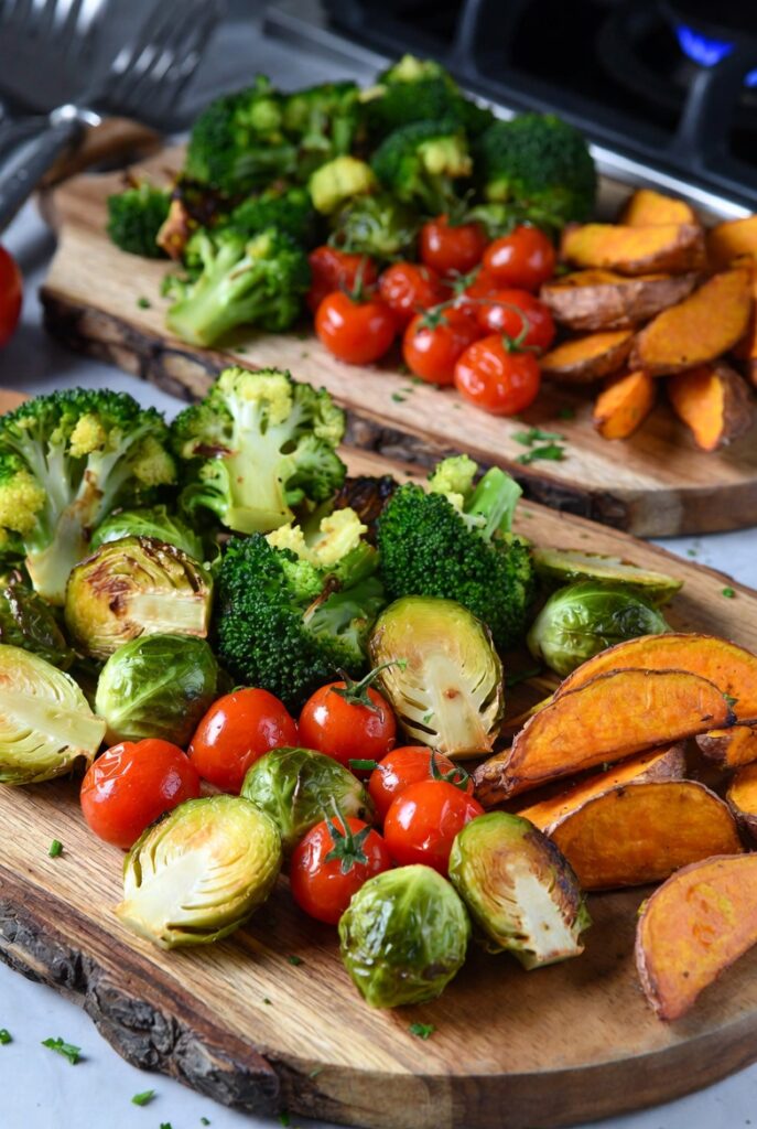 Easy air fryer vegetable recipes featuring crispy broccoli, brussels sprouts, and sweet potatoes for weekly meals